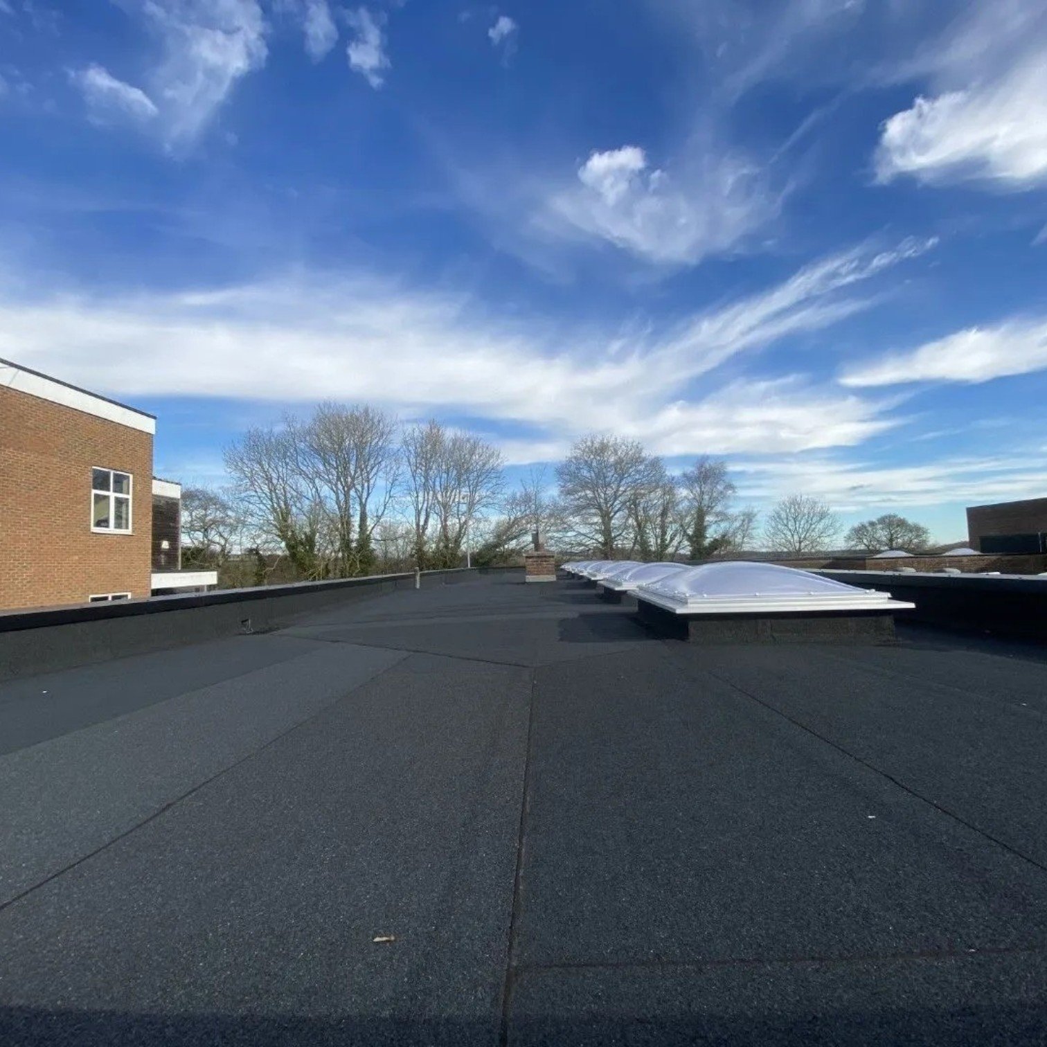 Flat roofing system installed on a low-slope roof in Edmonton