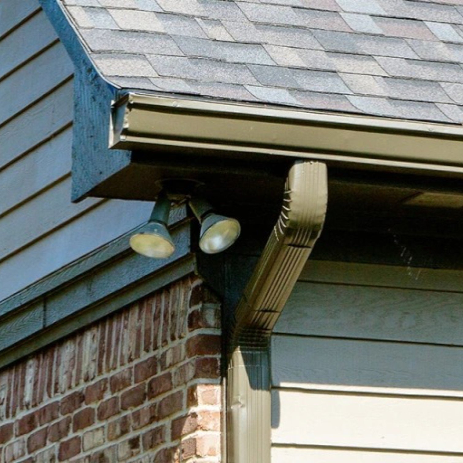 New gutter and downspout installation on a residential home in Edmonton